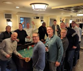 Photo Gallery 37 Powers Capital Management at Brittingham's Pub 2022 - Learning to play craps